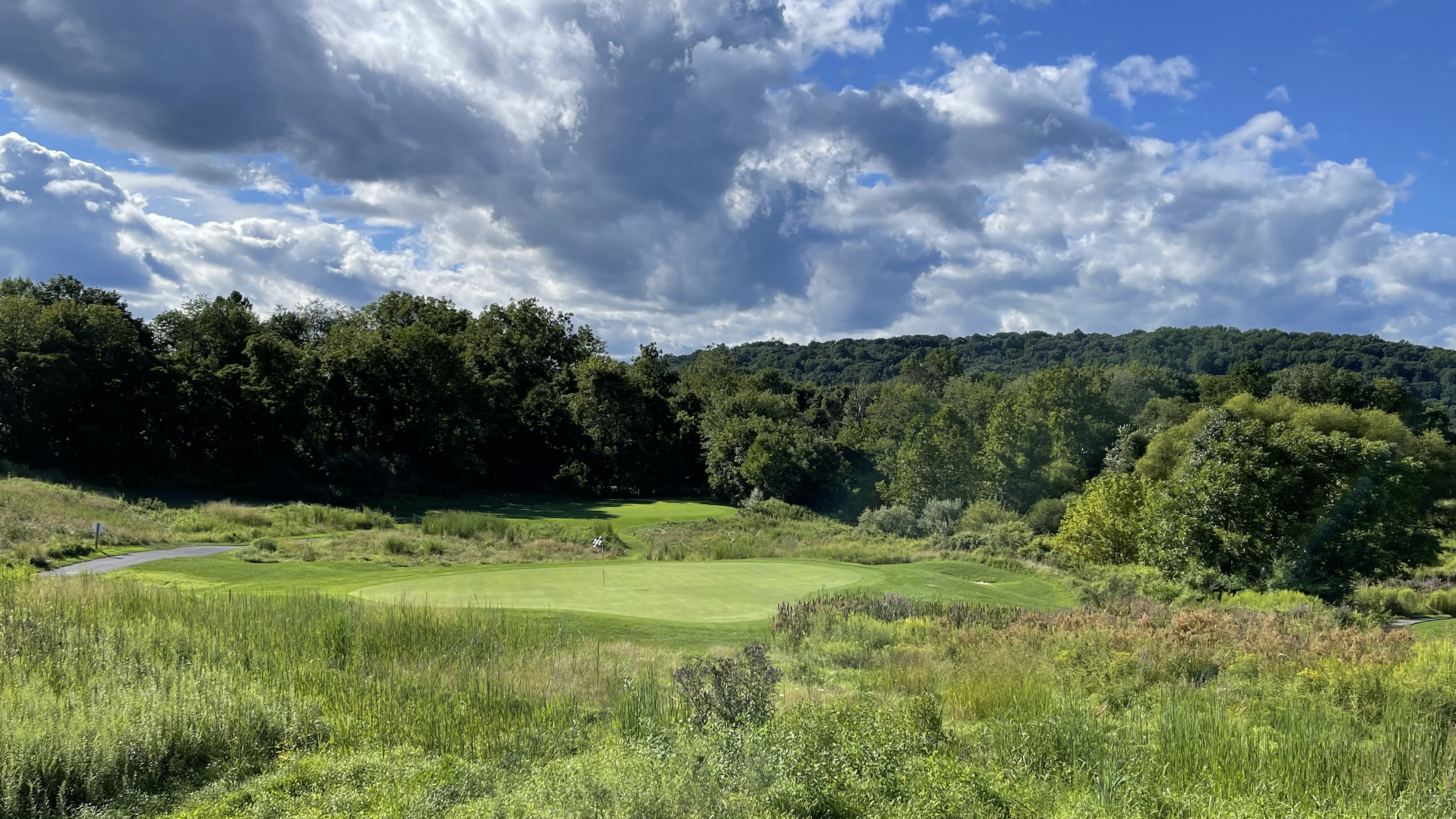 Championship fairway at High Bridge Hills Golf Club in High Bridge NJ surrounded by rolling hills and mature trees